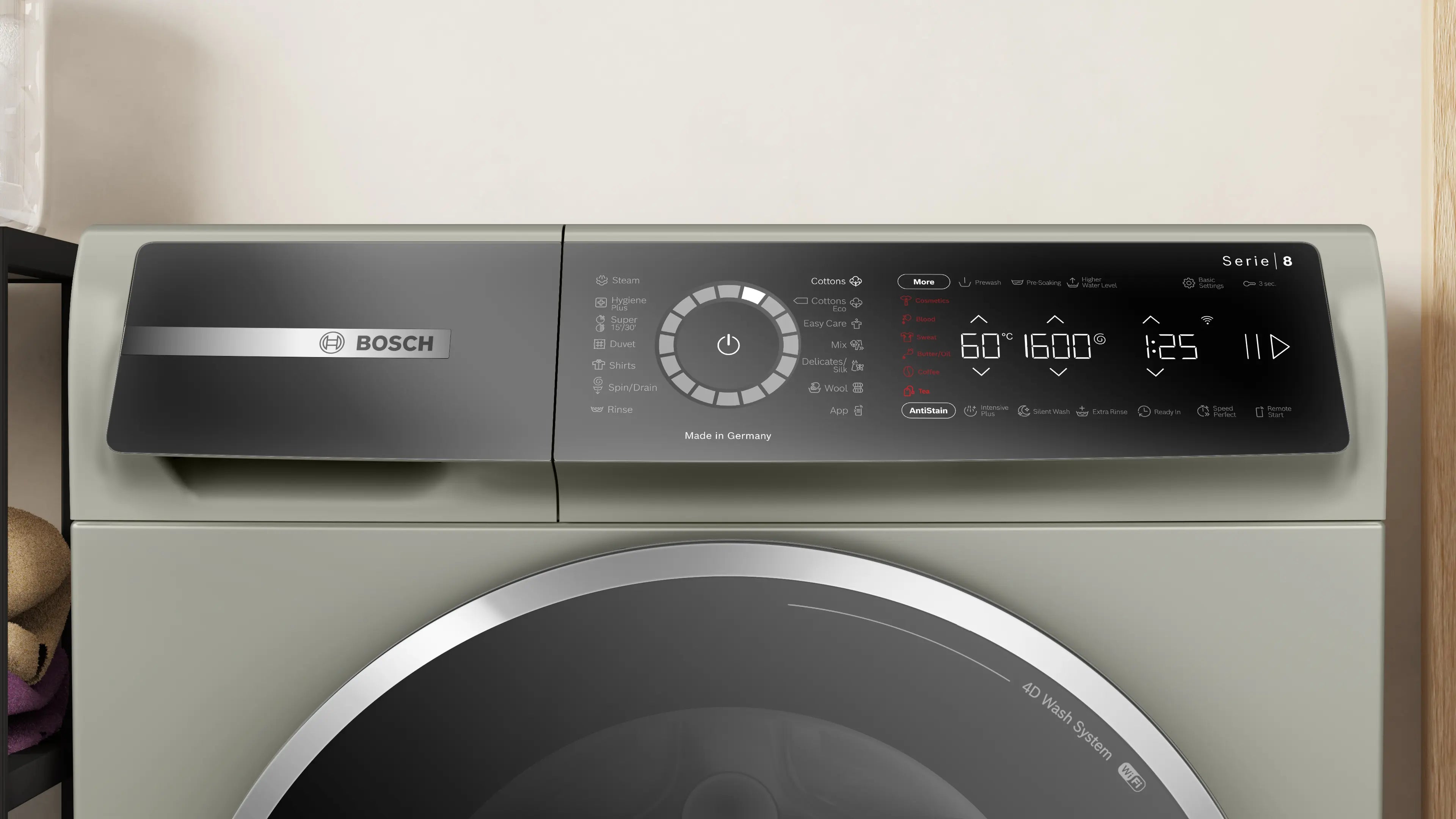 Bosch WGB2560XME front-loading washing machine in silver inox - angled front view