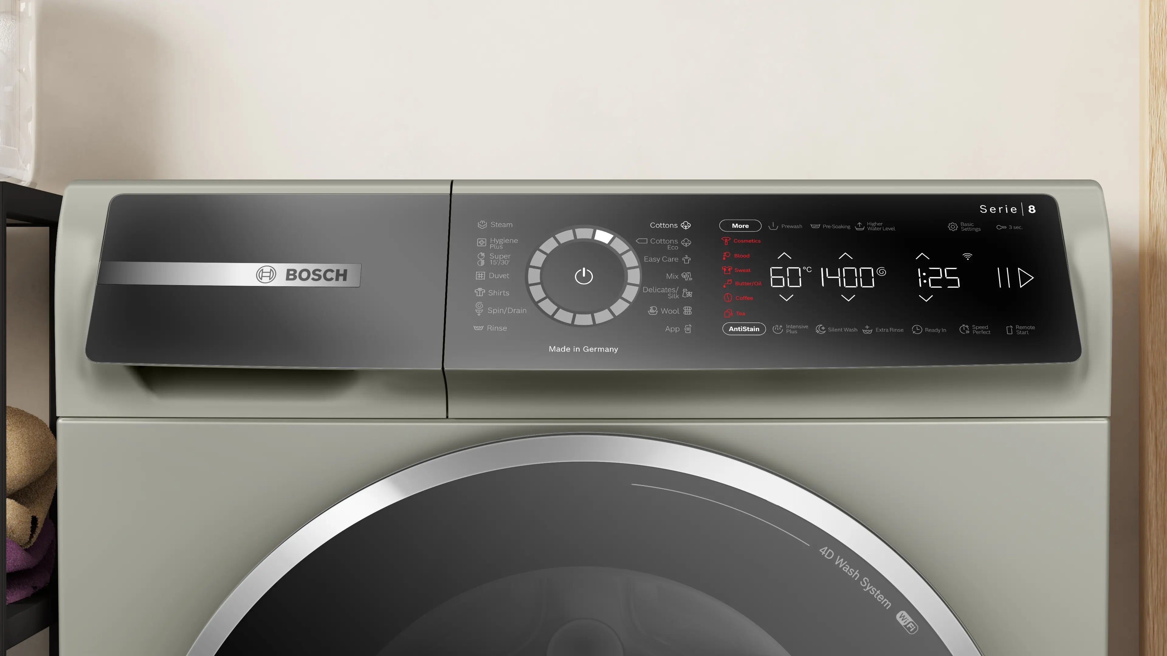 Bosch WGB2440XME front-loading washing machine in silver inox - angled front view