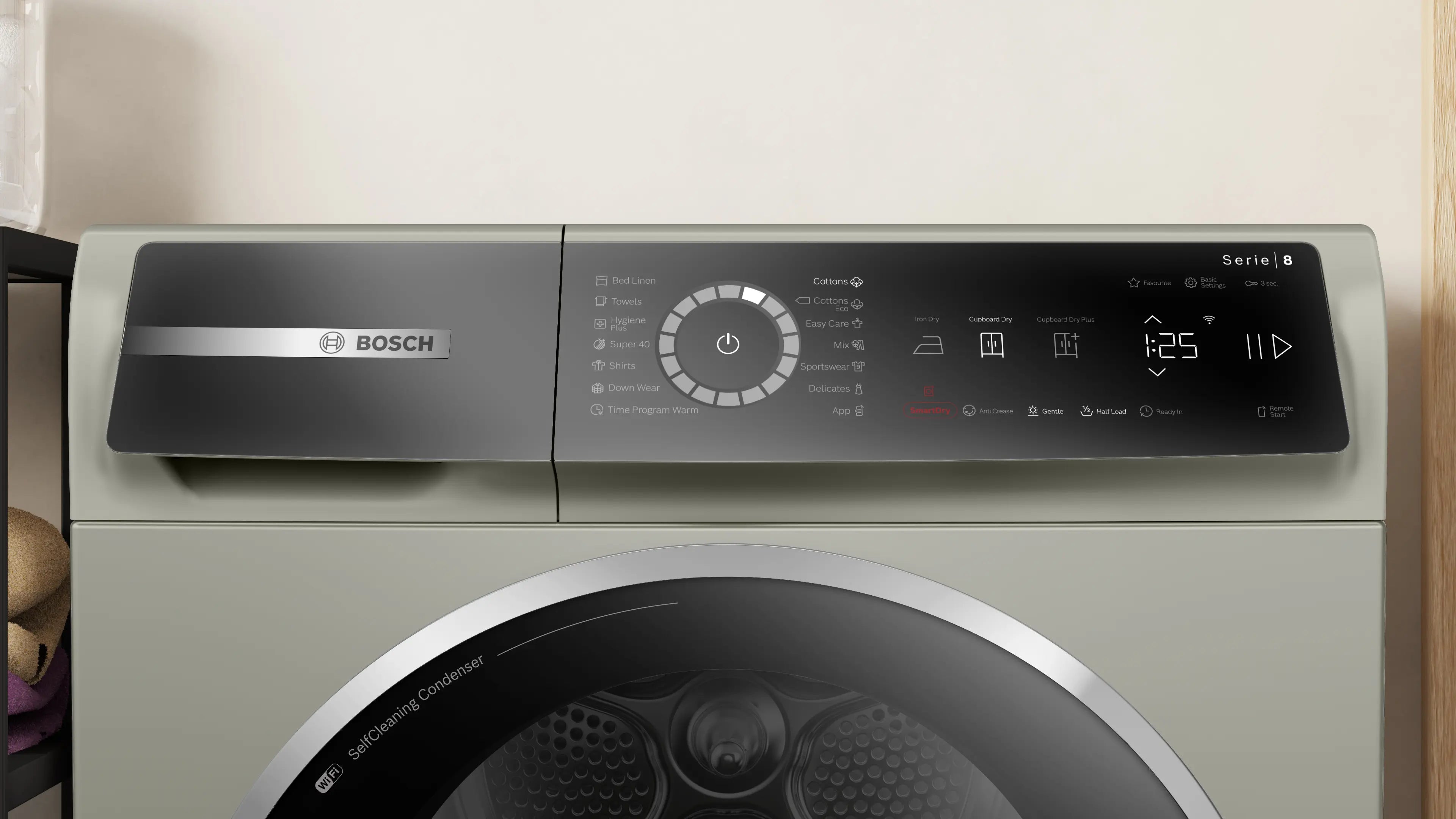 Bosch WQB245BXME heat pump tumble dryer in silver inox - angled front view