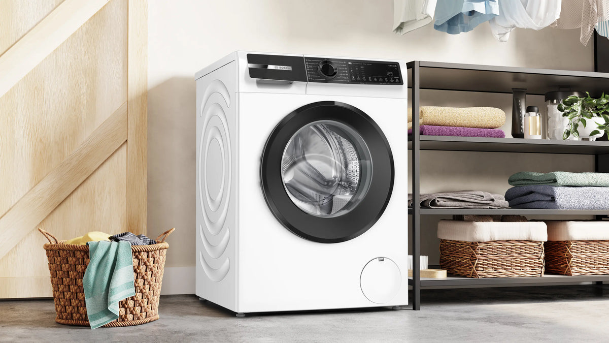Bosch WGK264Z0ME washing machine in a fitted laundry space