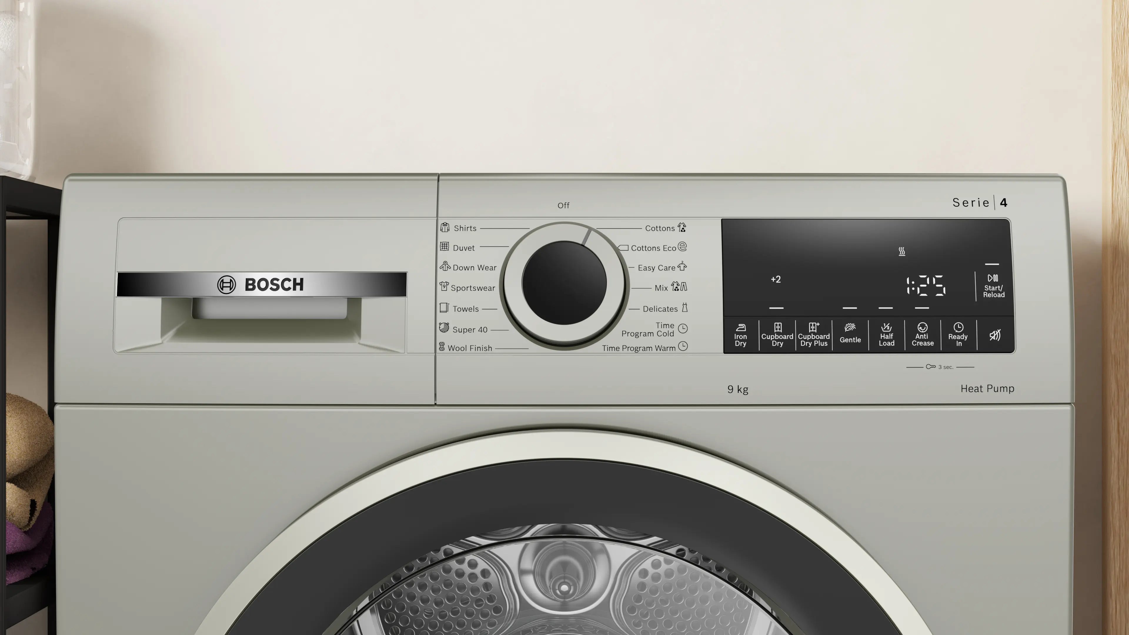 Bosch WQG1420XME heat pump tumble dryer in silver inox - angled front view