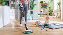 BCS71HYG1 vacuuming and mopping hardwood near a child for quick everyday cleanups.