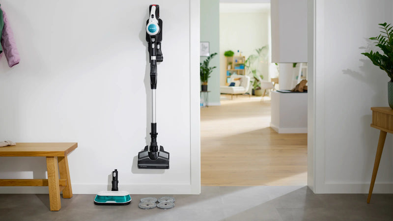 BCS71HYG1 slim wall dock with brush, mop head and spare pads neatly stored.