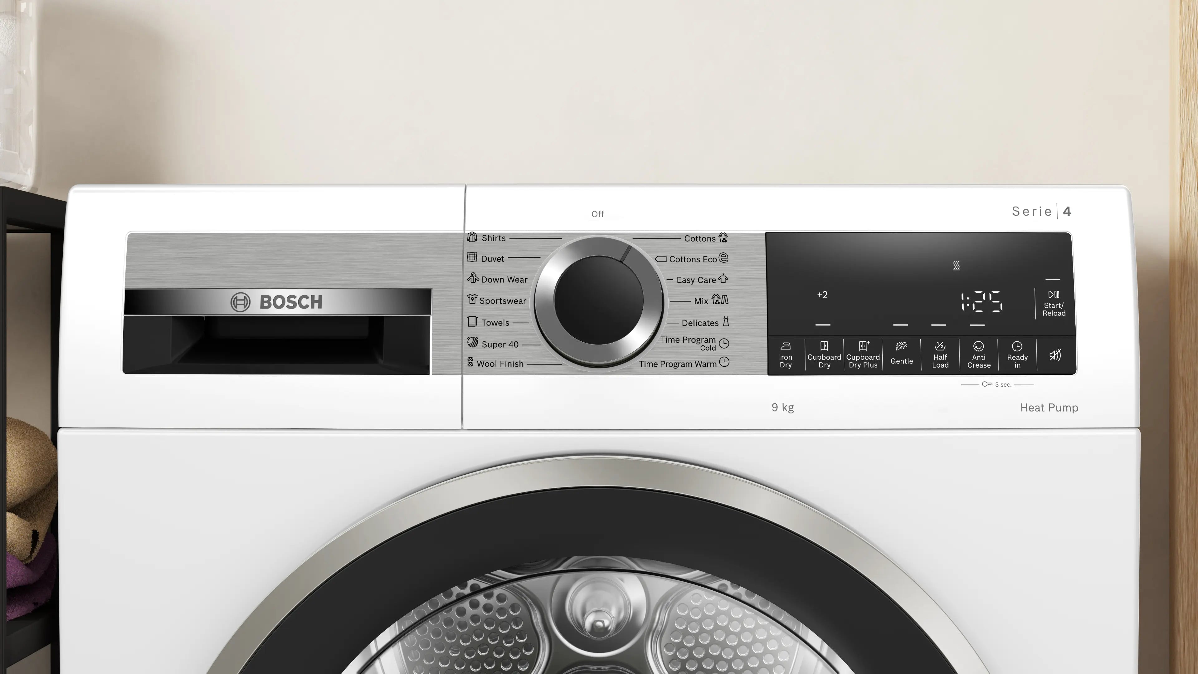 Bosch WQG1420AME heat pump tumble dryer in white - angled front view