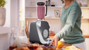 Bosch MUM58359 Series 4 with 1.25 L blender making a berry smoothie on the countertop