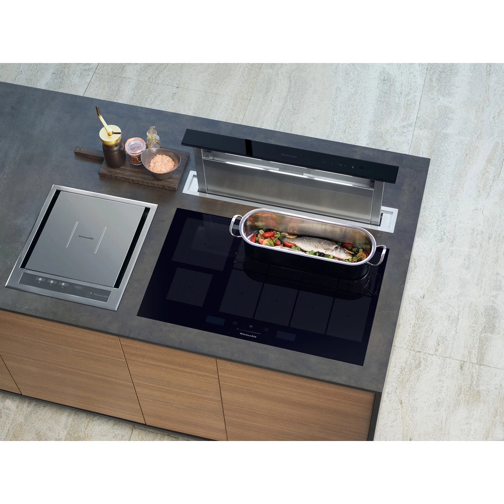 KitchenAid KHIAF 10900 90cm Built-In Induction Hob — Black Glass Ixellium Modern kitchen island with induction cooktop and built-in cookware.