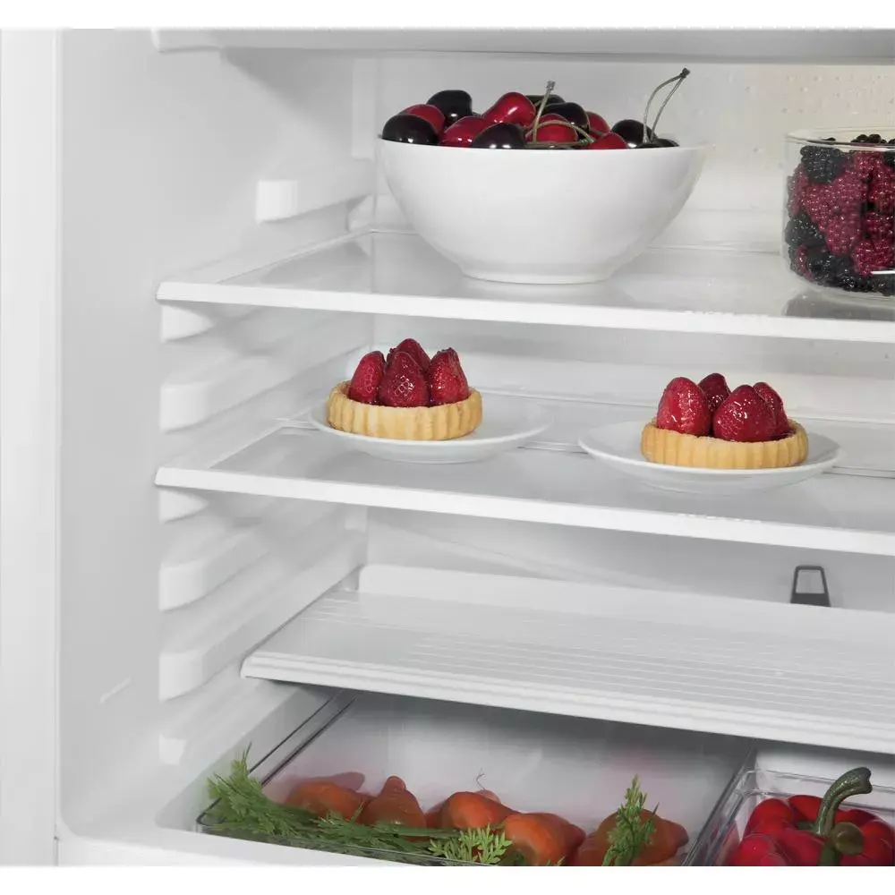 Whirlpool WBUF011 fridge freezer filled interior view